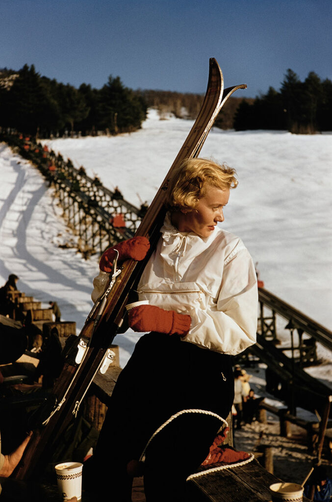 A woman holding her skis in North Conway, New Hampshire, 1955.