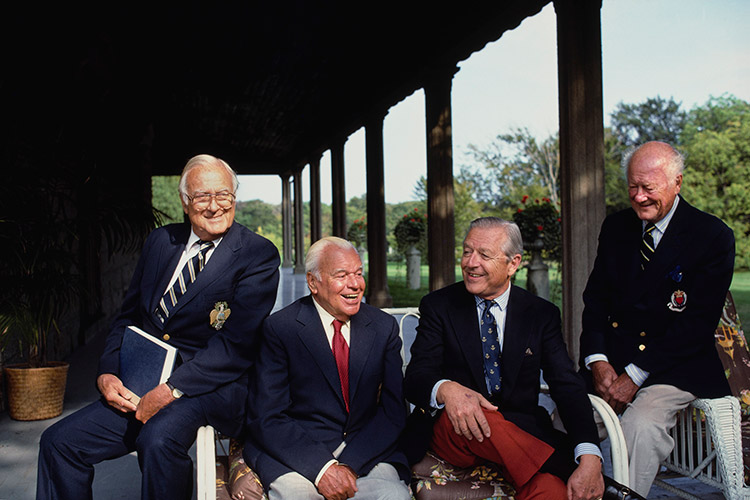 John J. Slocum, Beverly Bogert, John R. Drexel III, and Barclay Douglas seated on the veranda of Château-sur-Mer (built in 1852 for William Shepard Wetmore), 1987.