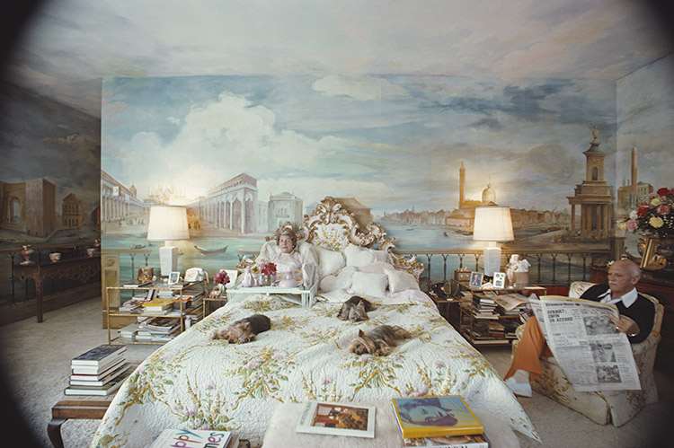 Mr. and Mrs. Alexander Saunderson in the bedroom of their home in Montecito, an opulent residential enclave of Santa Barbara, California, US, March 1975. Mrs. Saunderson had the bedroom walls painted by the English artist John Sander.